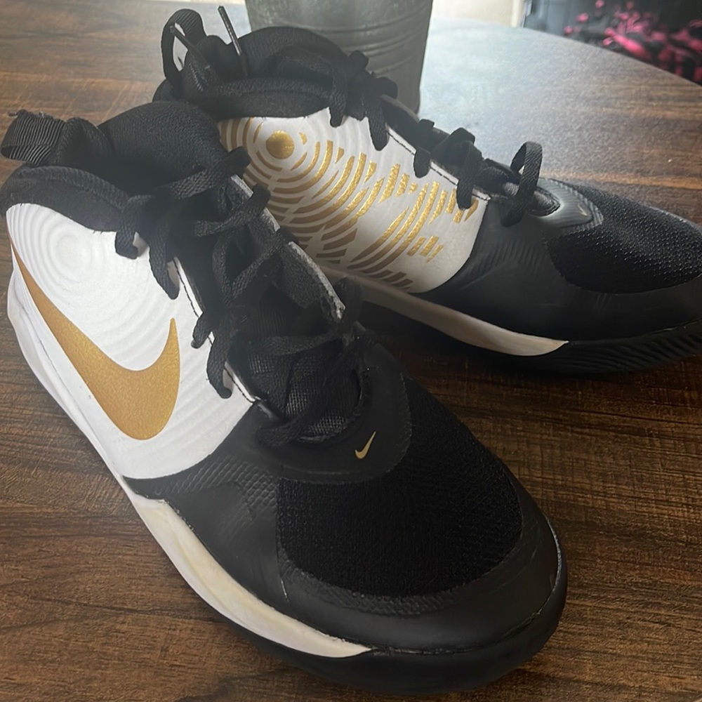 Nike black white and Gold